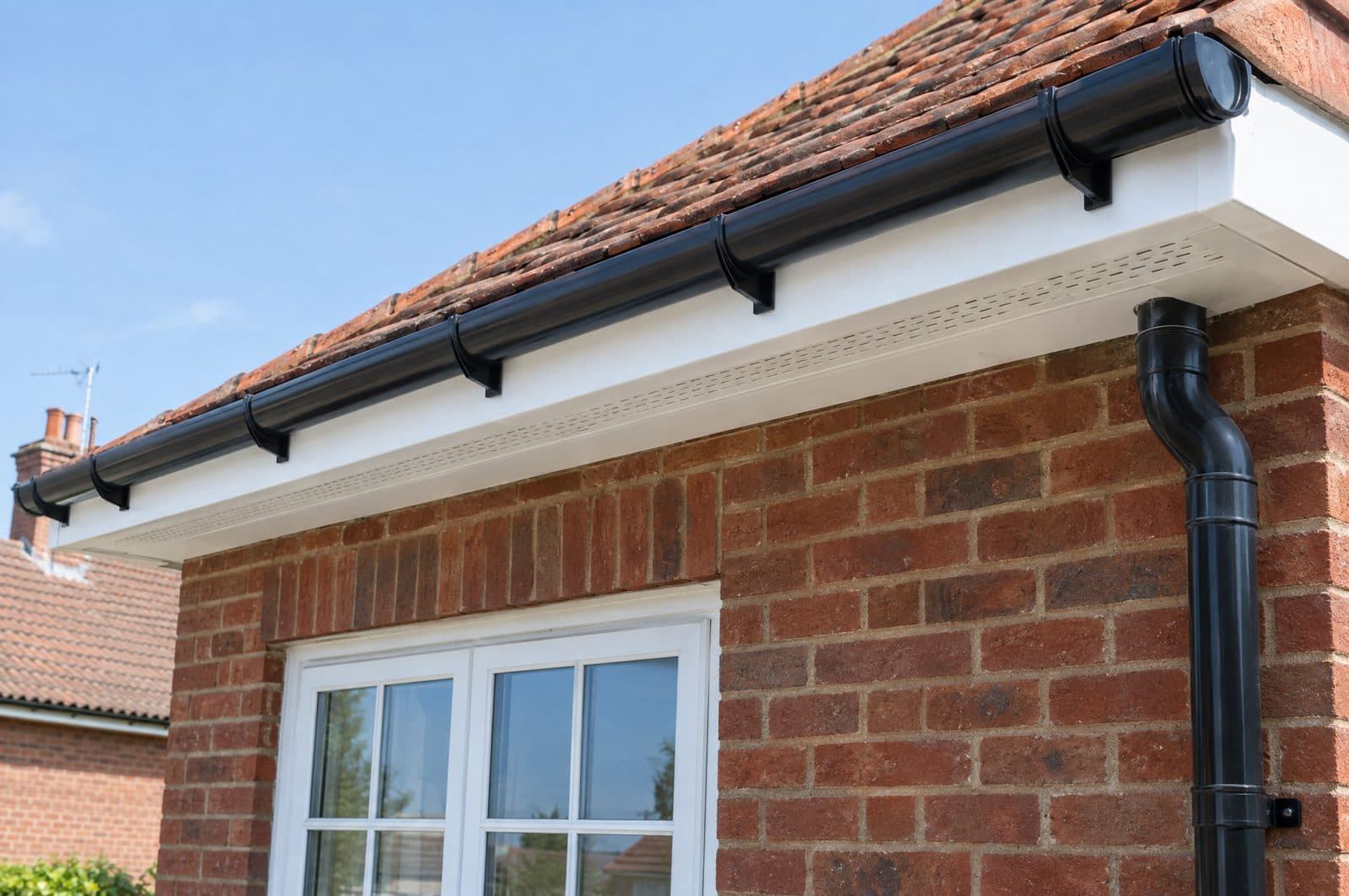The same eaves with a new white uPVC fascia and soffit and new black guttering