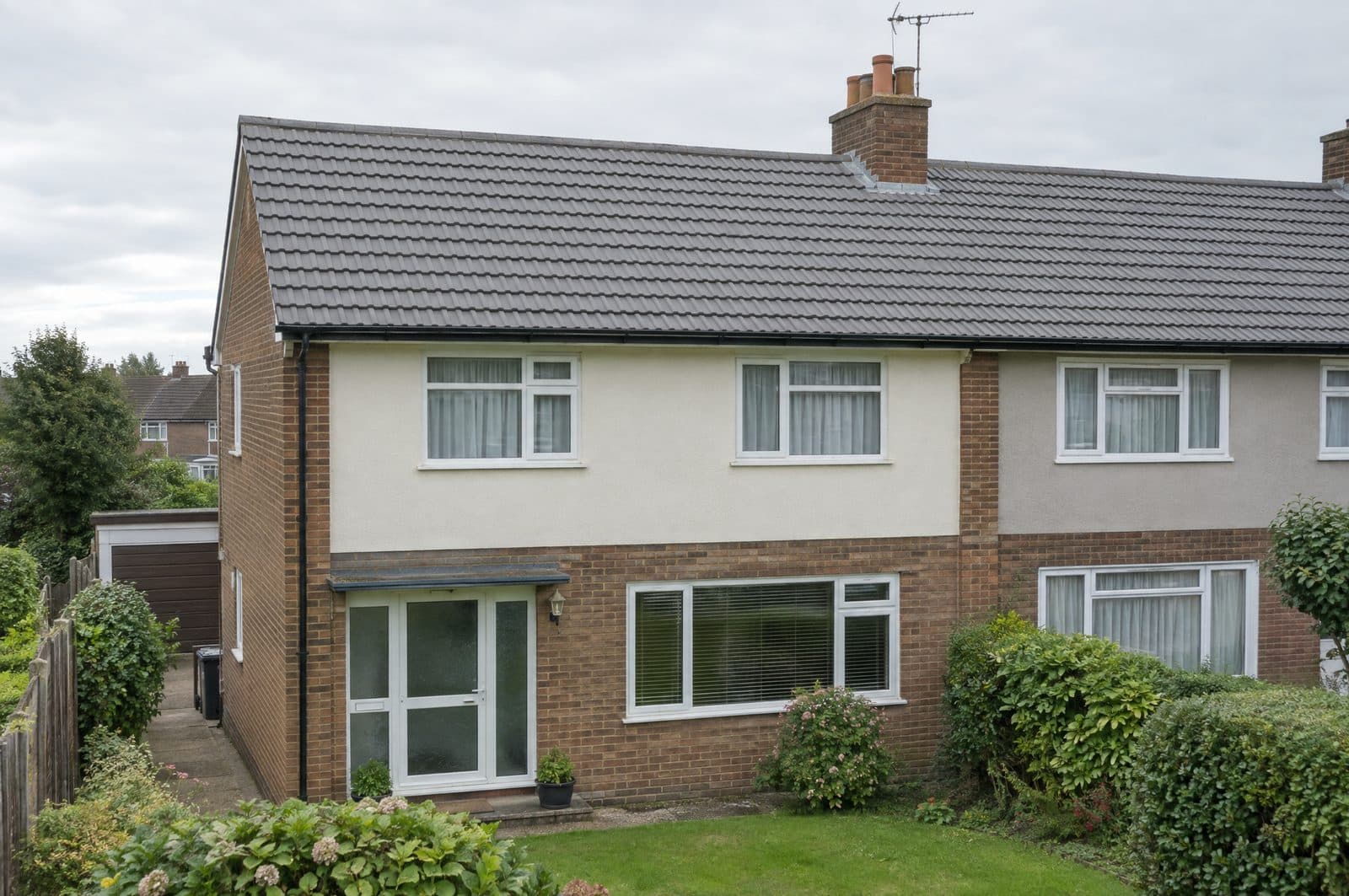 The same house with its roof tiles cleaned of moss